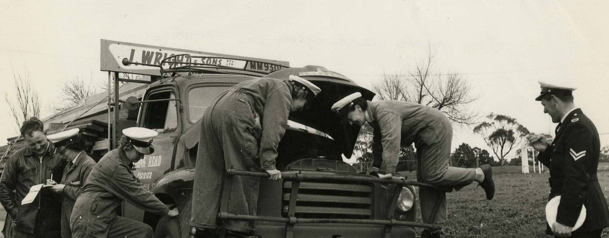 Group visits Photo of policewomen cadets inspecting truck for roadworthiness
