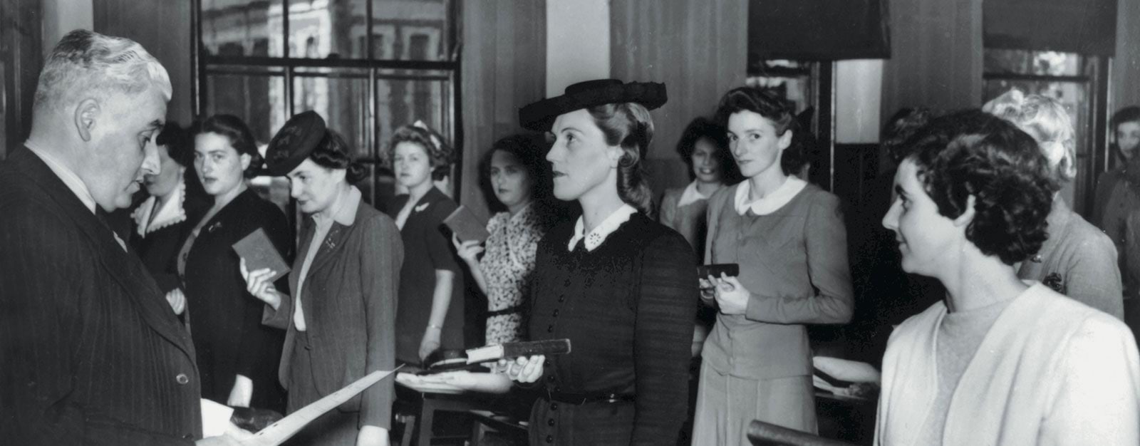 Photo of women police recruits swearing on the bible